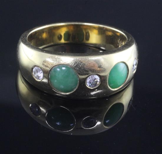 An 18ct gold and gypsy set jade and diamond five stone ring, size X.